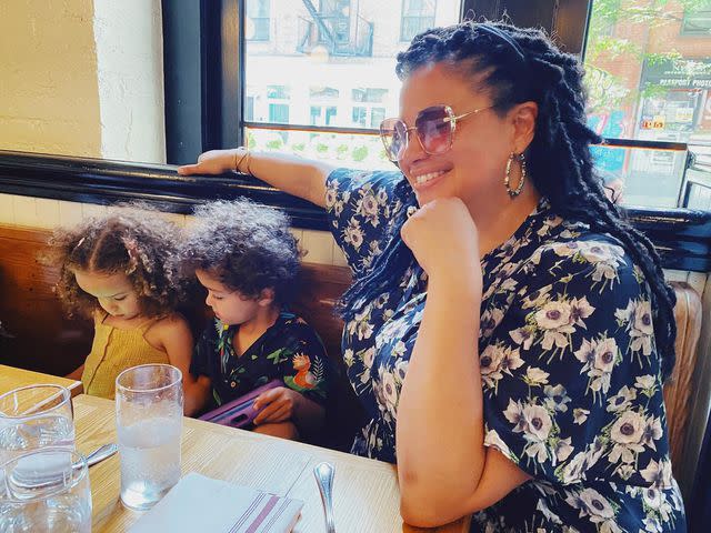 <p>Michelle Buteau Instagram</p> Michelle Buteau and her kids Hazel and Otis in May 2022