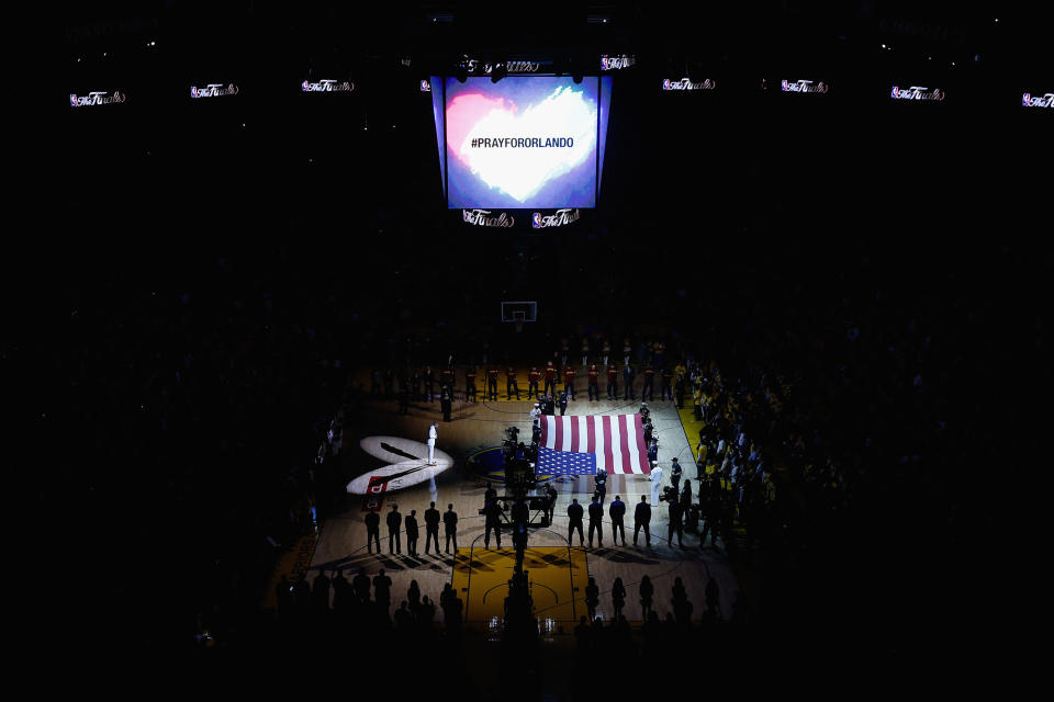 <p>A moment of silence is observed for victims of the Orlando nightclub mass shooting prior to Game 5 of the 2016 NBA Finals between the Cleveland Cavaliers and the Golden State Warriors at Oracle Arena on June 13, 2016 in Oakland, Calif. (Photo: Ezra Shaw/Getty Images) </p>