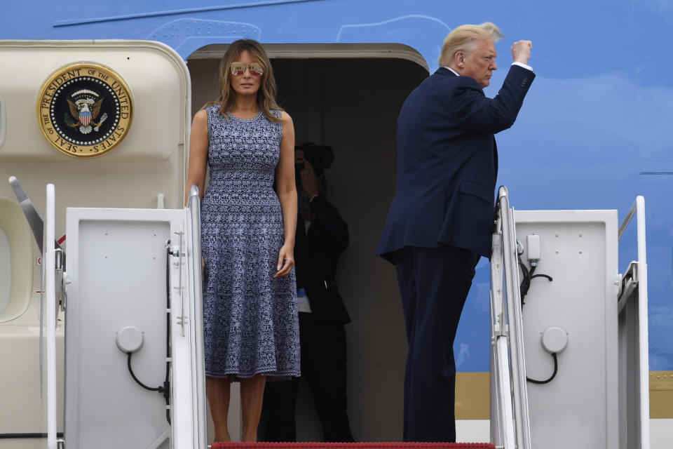 President Donald Trump and first lady Melania Trump board Air Force One for a trip to attend the SpaceX Demonstration Mission 2 Launch at Kennedy Space Center, Wednesday, May 27, 2020, in Andrews Air Force Base, Md. (AP Photo/Susan Walsh)