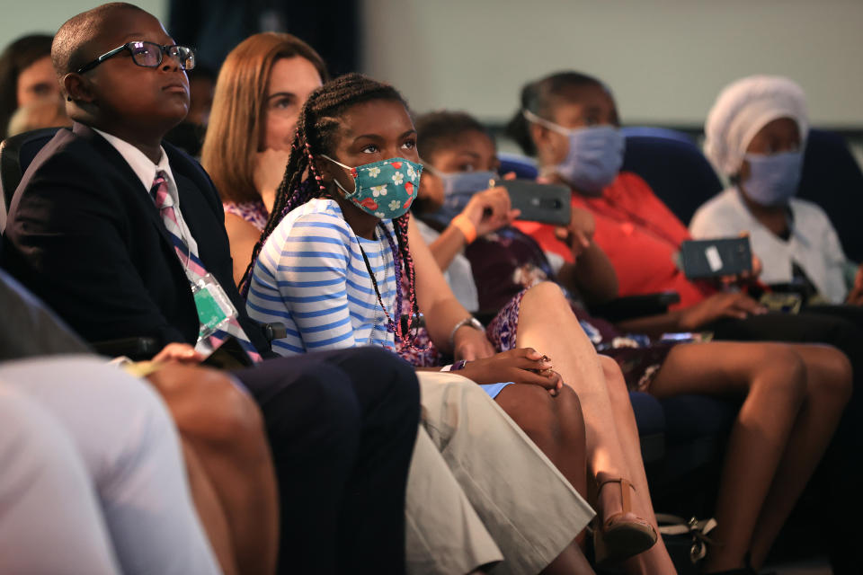 WASHINGTON, DC - JULY 15: Nine families that are benefiting from the new Child Tax Credit listen to U.S. President Joe Biden and Vice President Kamala Harris deliver remarks on the day tens of millions of parents will get their first monthly payments in the South Court Auditorium in the Eisenhower Executive Office Building on July 15, 2021 in Washington, DC. Most families will receive up to $300 per child a month, a temporary increase in the child tax credit that was part of the American Rescue Plan. (Photo by Chip Somodevilla/Getty Images)