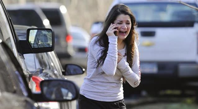 The iconic picture of Carlee Soto which was taken as she learnt her sister had died in the Sandy Hook massacre. Photo: Yahoo7/ AP