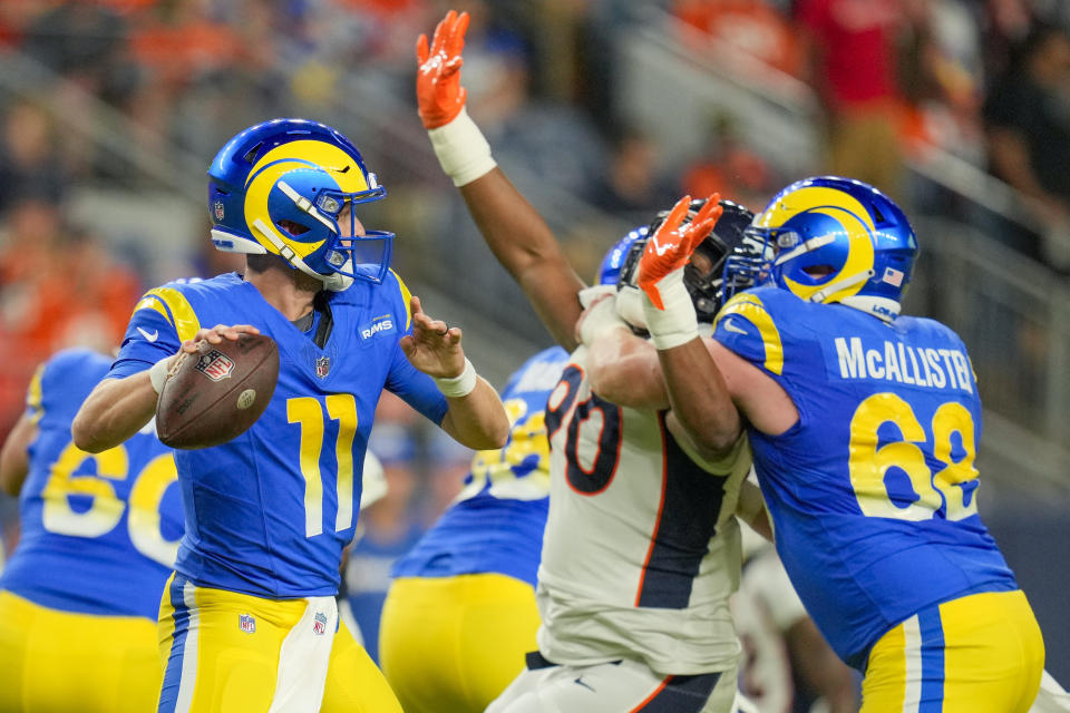 Los Angeles Rams quarterback Brett Rypien passes against the Denver Broncos during the first half of an NFL preseason football game Saturday, Aug. 26, 2023, in Denver. (AP Photo/Jack Dempsey)