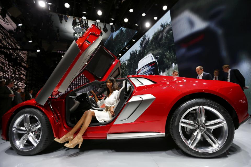 A model poses in an Audi Nanuk Quattro concept car during a media preview day at the Frankfurt Motor Show (IAA) September 10, 2013. The world's biggest auto show is open to the public September 14 -22. REUTERS/Kai Pfaffenbach (GERMANY - Tags: BUSINESS TRANSPORT TPX IMAGES OF THE DAY)