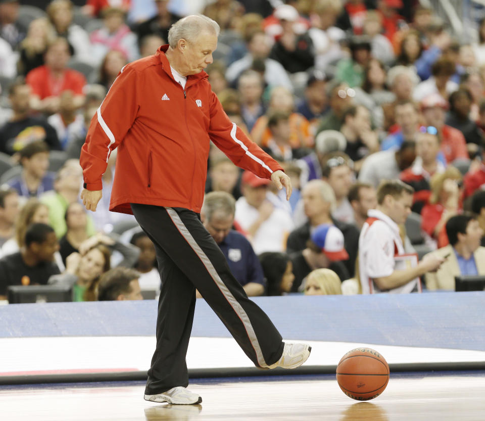 Wisconsin head coach Bo Ryan clears a ball from the floor during practice for an NCAA Final Four tournament college basketball semifinal game Friday, April 4, 2014, in Dallas. Wisconsin plays Kentucky on Saturday, April 5, 2014. (AP Photo/Charlie Neibergall)