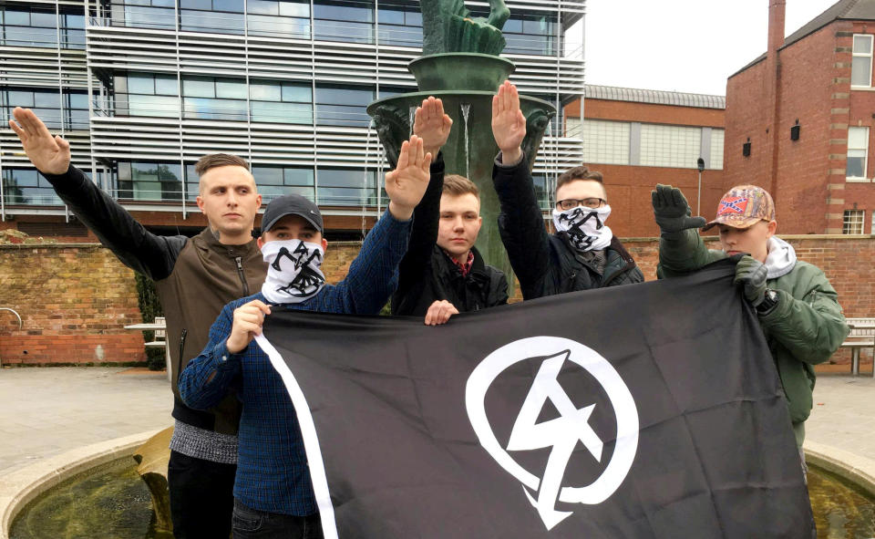 Posing with the National Action flag.