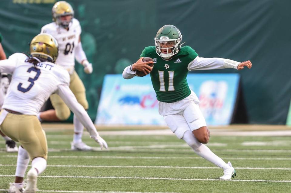 Cal Poly Mustangs quarterback Jaden Jones (11) runs the ball up the middle. Cal Poly Football hosted UC Davis. Photo by Owen Main