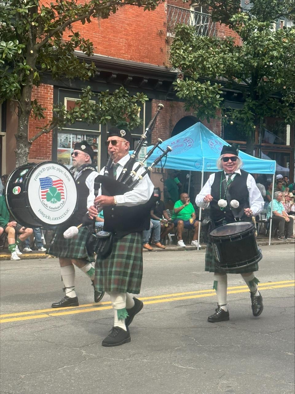 Tom Glynn (left) and Connie Beagan (right) flew in from Connecticut with the Fairfield Gaelic Pipe Band.