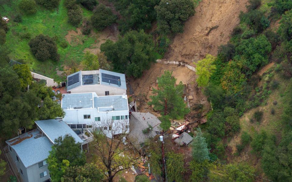 A property on Hollywood Hills is destroyed at the bottom of a landslide