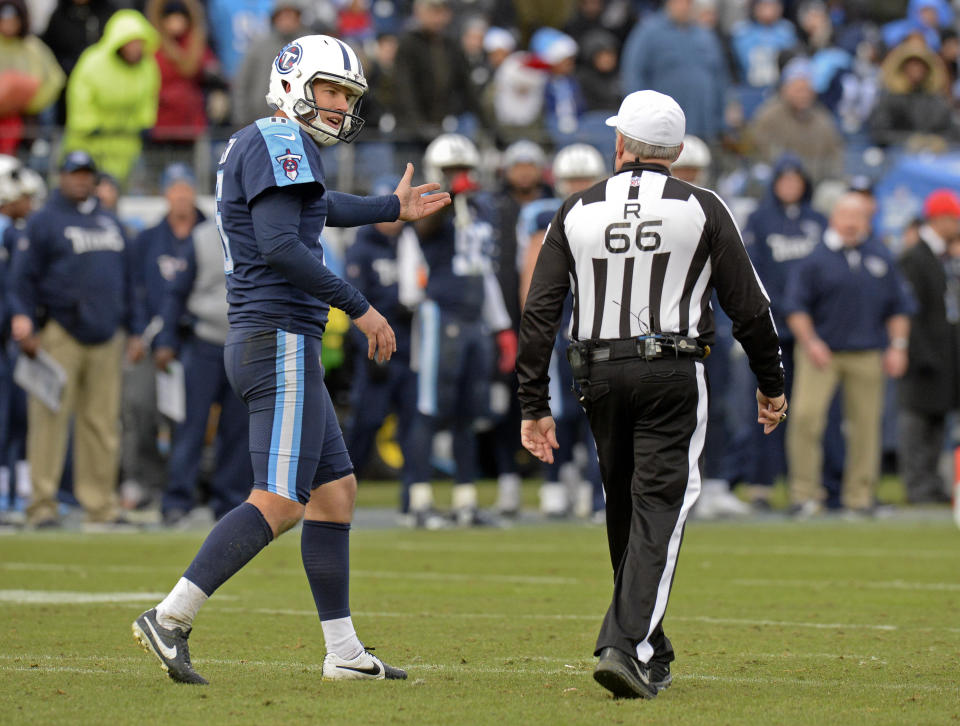Tennessee Titans punter Brett Kern argues his case with referee Walt Anderson in the second half of Sunday’s game against the Los Angeles Rams. Anderson’s crew made a second-half mistake that negated a successful onside kick for Tennessee. (AP)