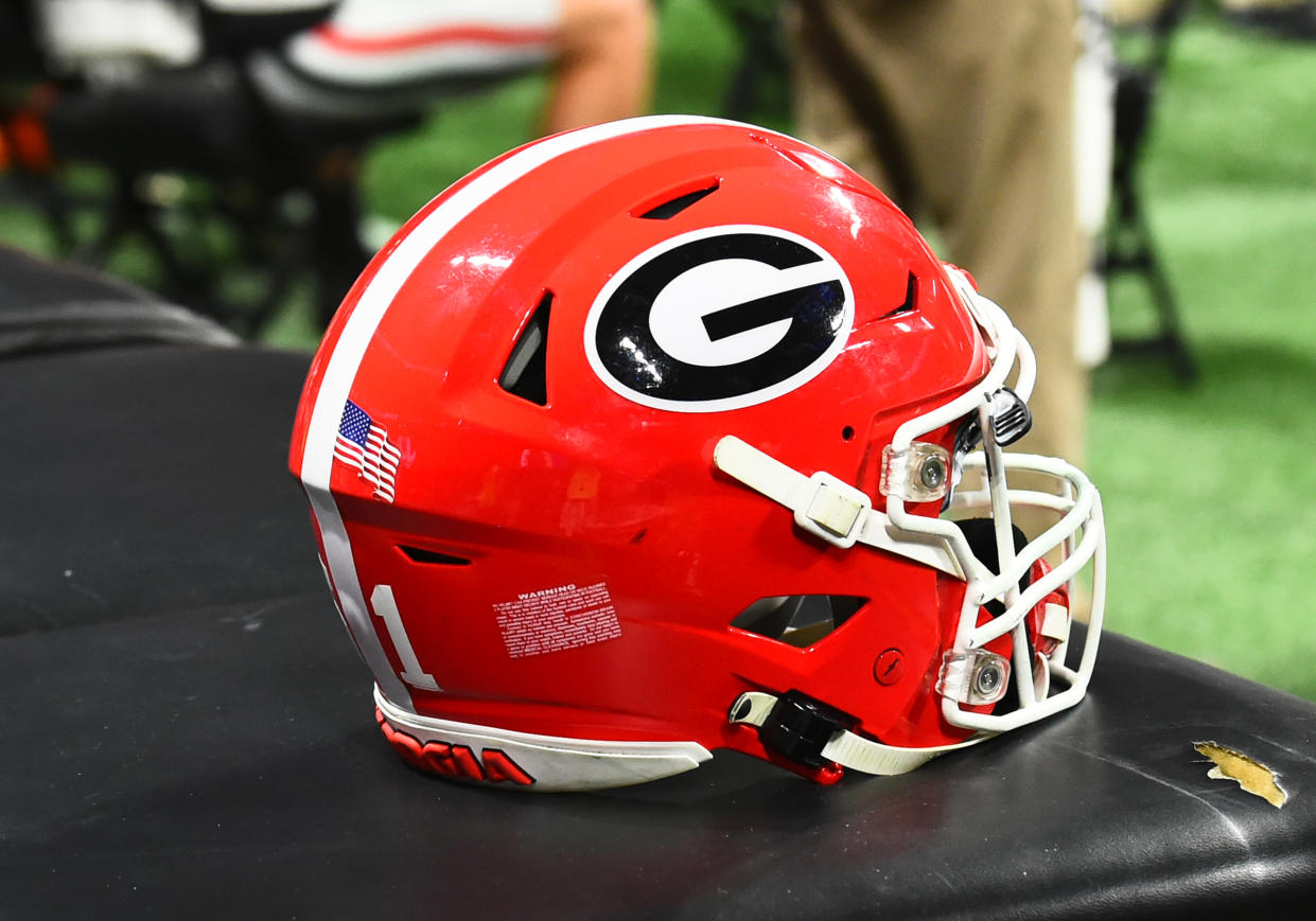 ATLANTA, GA - DECEMBER 02: A Georgia Bulldogs football helmet sits on the sideline during the SEC Championship Game between the Georgia Bulldogs and the Alabama Crimson Tide on December 02, 2023, at Mercedes-Benz Stadium in Atlanta, GA. (Photo by Jeffrey Vest/Icon Sportswire via Getty Images)