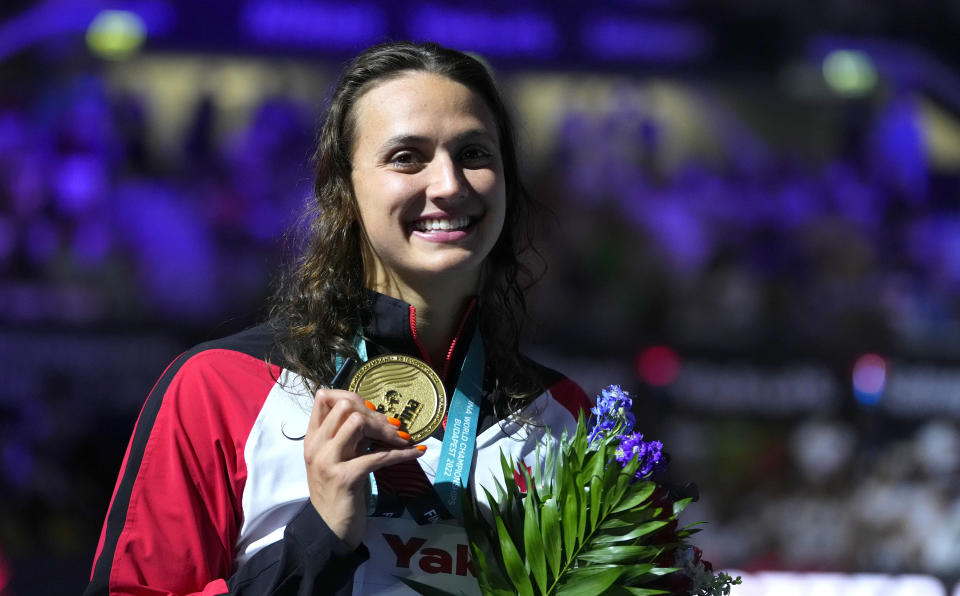 Gold medalist Kylie Masse of Canada poses with her medal after the Women 50m Backstroke final at the 19th FINA World Championships in Budapest, Hungary, Wednesday, June 22, 2022. (AP Photo/Petr David Josek)