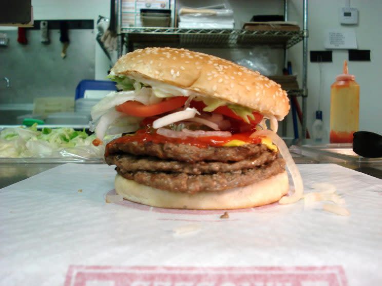 Burger King, Triple Whopper with Cheese. Nutritional info: Calories 1,240, Fat 83 g (Saturated Fat 32 g and Trans Fat 3 g), Sodium 1,470 mg, Carbohydrates 49 g, Sugar 11 g <em>(Photo: Wikimedia Commons)</em>