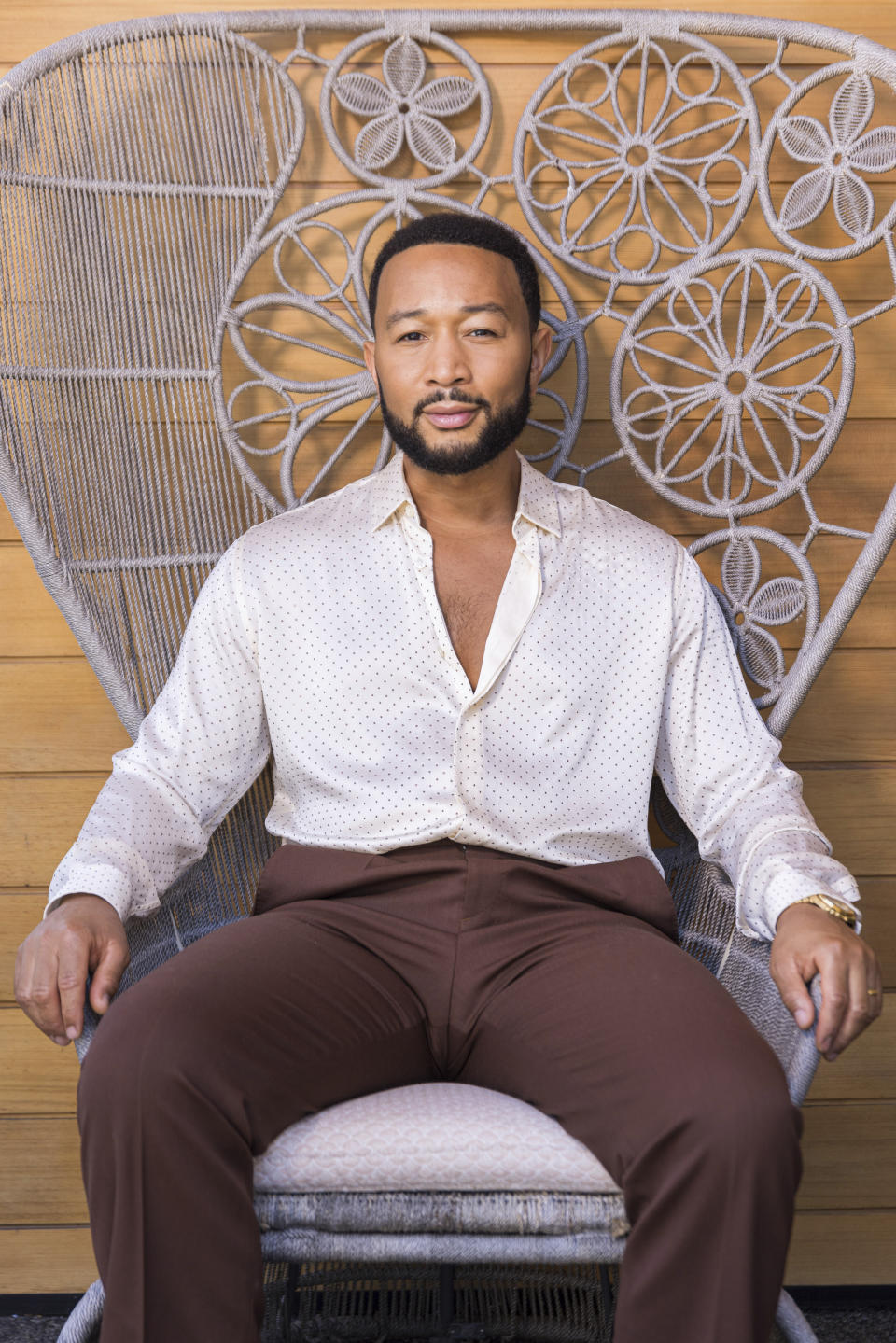 John Legend poses for a portrait on Monday, Aug. 15, 2022, in West Hollywood, Calif., to promote his latest double album "Legend." (Photo by Willy Sanjuan/Invision/AP)