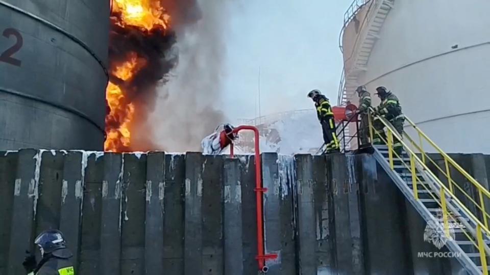 Members of the Russian emergencies ministry work to extinguish fire at an oil storage tank after an alleged drone attack in the town of Azov in the southern region of Rostov (via REUTERS)