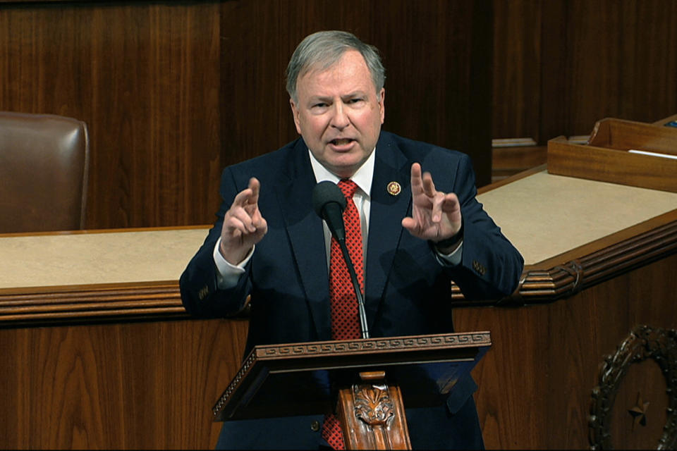 FILE - In this Dec. 18, 2019, photo, Rep. Doug Lamborn, R-Colo., speaks at the Capitol in Washington. A congressional ethics watchdog has concluded that U.S. Reps. Marie Newman of Illinois and Lamborn of Colorado may have violated federal law, prompting reviews from the House Ethics Committee. (House Television via AP, File)