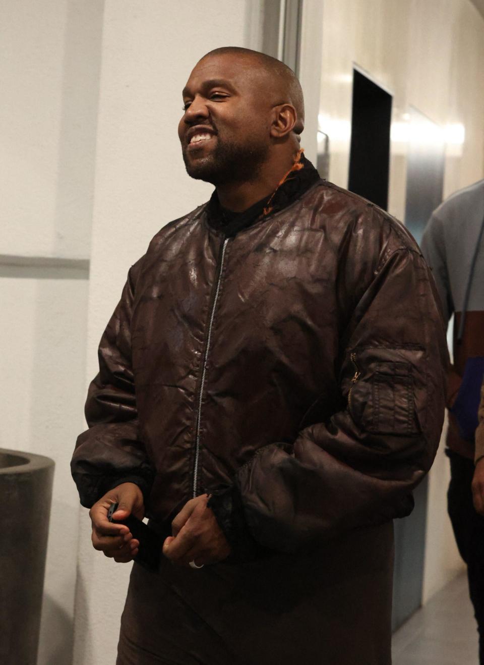 Kanye was seen leaving e.baldi restaurant smiling after dining with friends