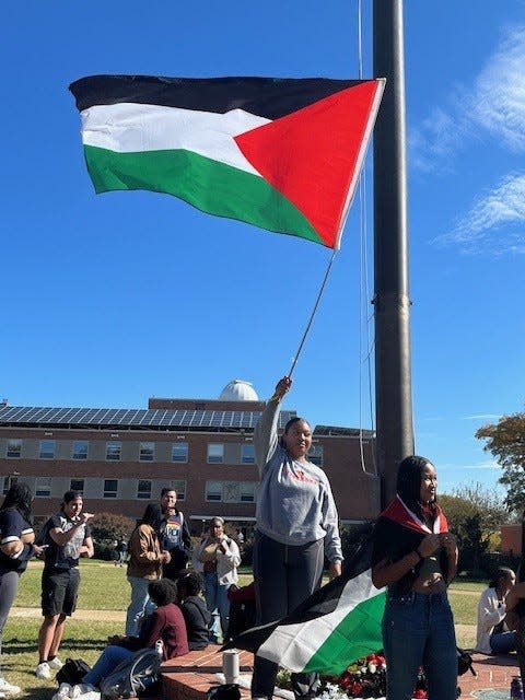 Maya Waller, a student at Howard University in Washington, D.C., waved a Palestinian flag Oct. 25, 2023 at a rally on campus.