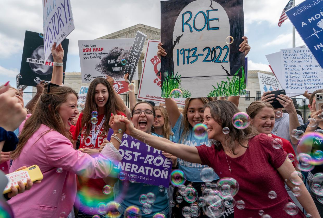 Anti-abortion protesters celebrate following Supreme Court's decision to overturn Roe v. Wade, a federally protected right to abortion, outside the Supreme Court in Washington, D.C. on Friday, June 24, 2022. 