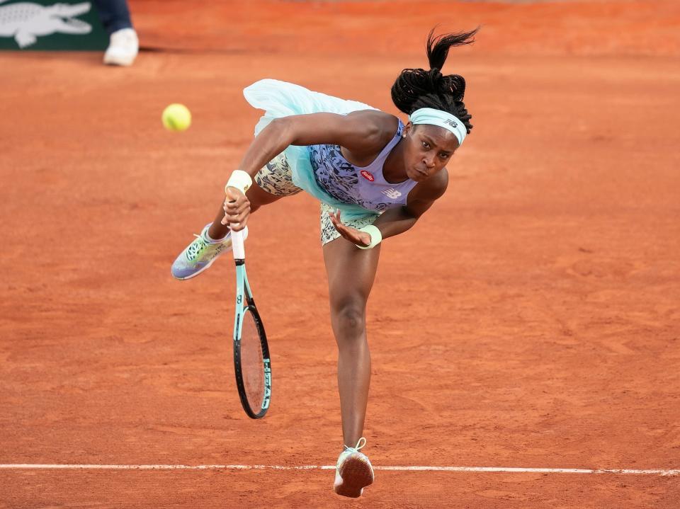 Coco Gauff serves a ball at the 2022 French Open.