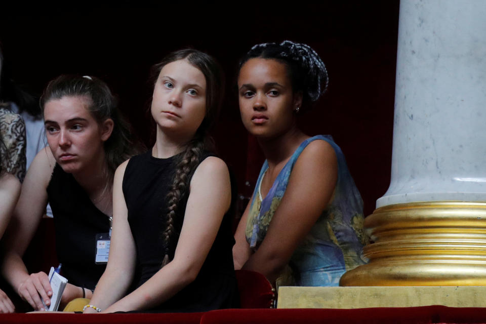 Swedish environmental activist Greta Thunberg, Adelaide Charlier and Alicia Arquetoux, French activists from the Youth for Climate movement, attend the questions to the government session at the National Assembly in Paris, France, July 23, 2019.  REUTERS/Philippe Wojazer