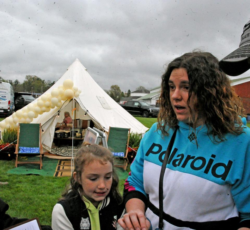 Dixie and Shaina Crank of Wooster are very interested in using the tent in the background for a glamping experience for the family. They were checking it out Saturday at the Wayne County Home and Garden Show.