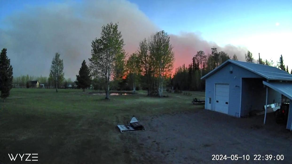 The smoke from the Parker Lake wildfire is seen from a surveillance camera in Fort Nelson, B.C., on May 10. (Submitted by Claude Normandeau - image credit)
