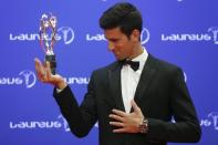 Tennis player Novak Djokovic of Serbia poses with his Laureus World Sportsman of the Year award during the Laureus World Sports Awards 2016 in Berlin, Germany, April 18, 2016. REUTERS/Hannibal Hanschke