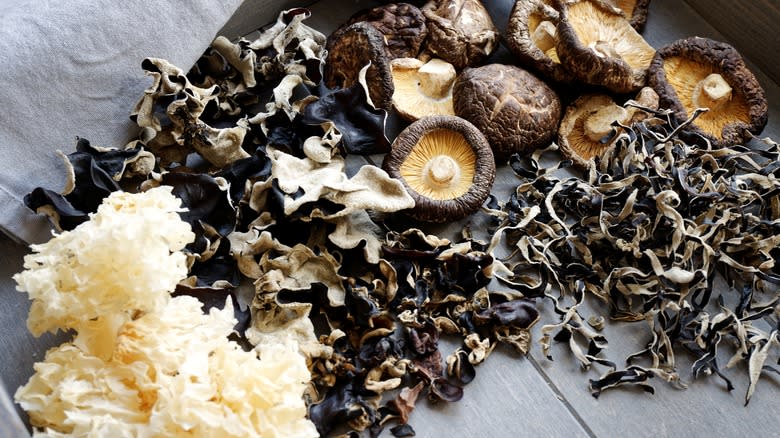 Various dried mushrooms on table