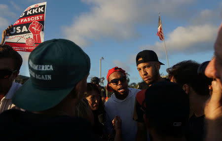 Demonstrators and counter-protesters face off during a protest at the America First rally in Laguna Beach, California, U.S., August 20, 2017. REUTERS/Sandy Huffaker