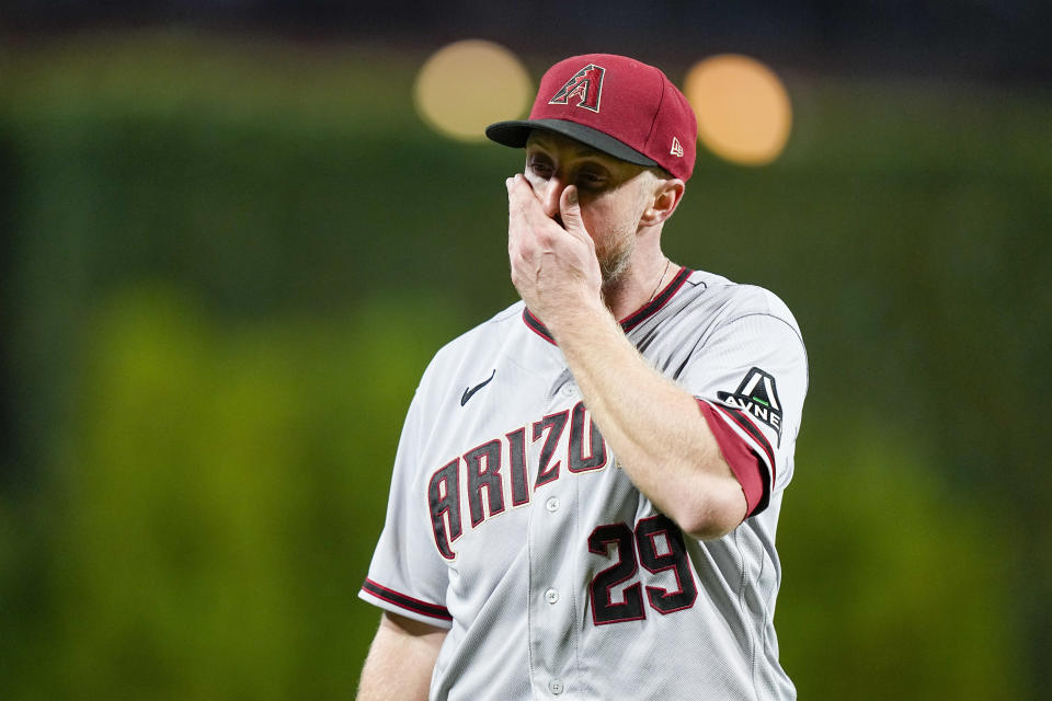 Arizona Diamondbacks starting pitcher Merrill Kelly leaves the game against the Philadelphia Phillies during the sixth inning in Game 2 of the baseball NL Championship Series in Philadelphia, Tuesday, Oct. 17, 2023. (AP Photo/Brynn Anderson)