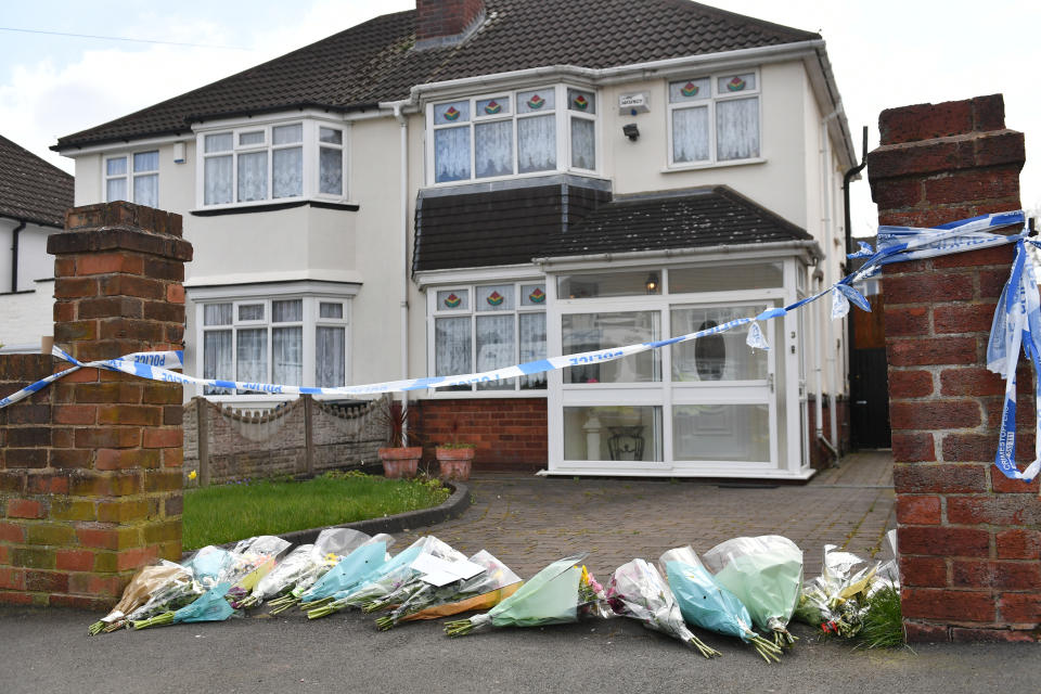 Flowers outside the house on Boundary Avenue in Rowley Regis, West Midlands, where a woman in her 80s died after being attacked by two escaped dogs. Picture date: Saturday April 3, 2021.