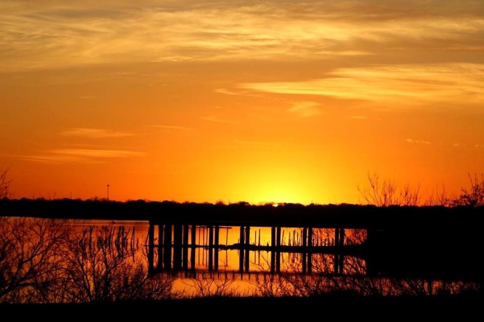 These posts jutting into the shallow water of Lake Wichita are all that remains from an era when the lake was a top recreational attraction.