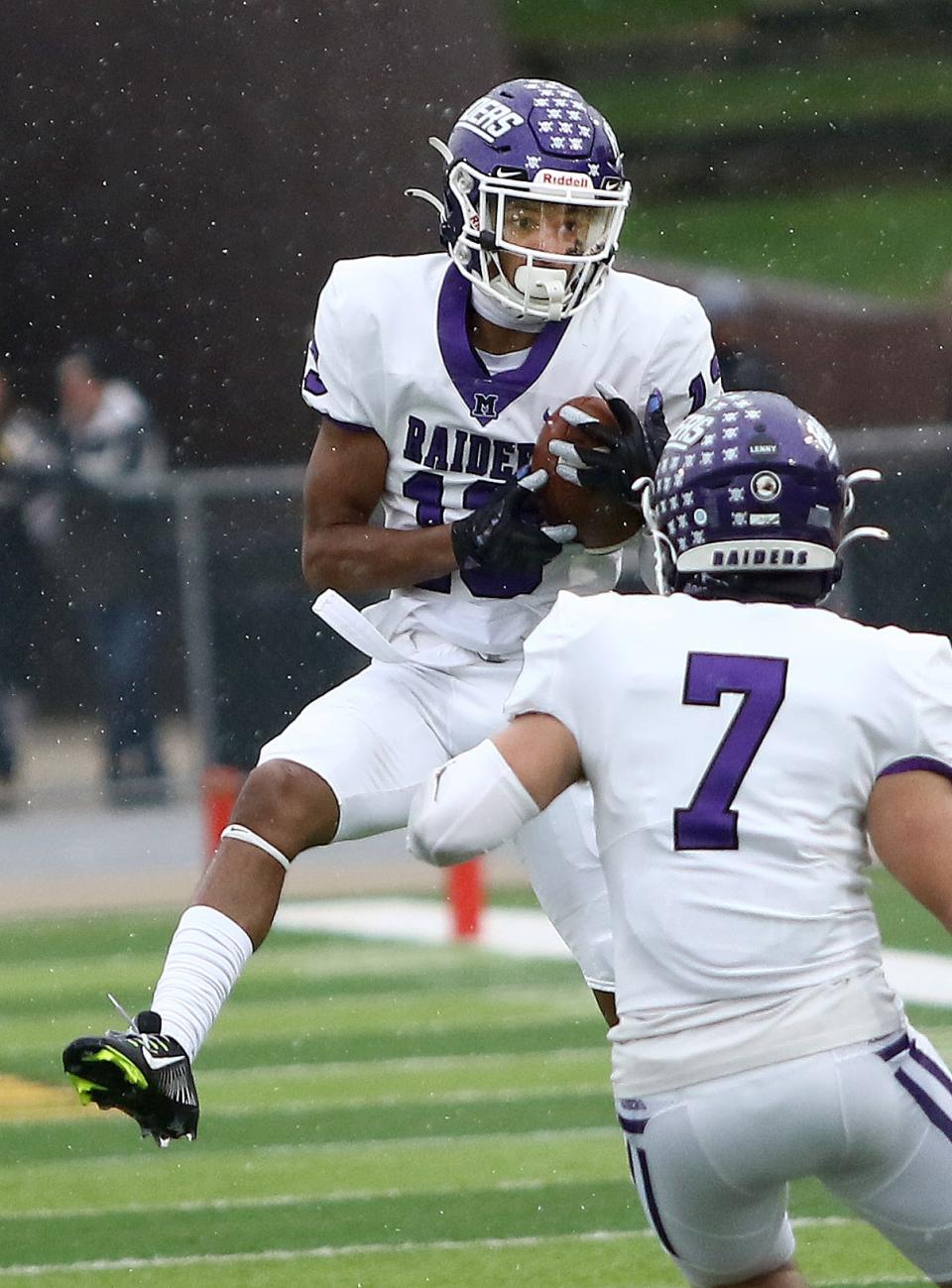 Mount Union's Jay Farrar pulls in an interception in the second quarter during action at Baldwin Wallace Saturday, November 12, 2022.