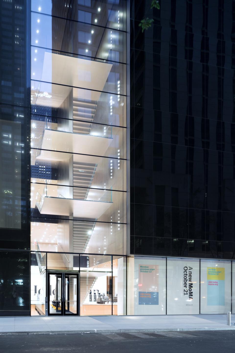 The exterior of the new MoMA shows a staircase that leads to new galleries in what was once the American Folk Art Museum.