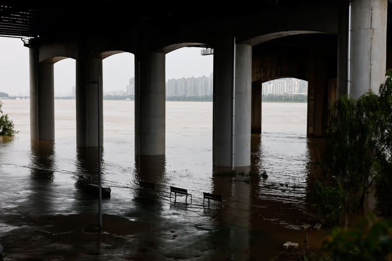 Partially submerged benches at a Han River Park in Seoul