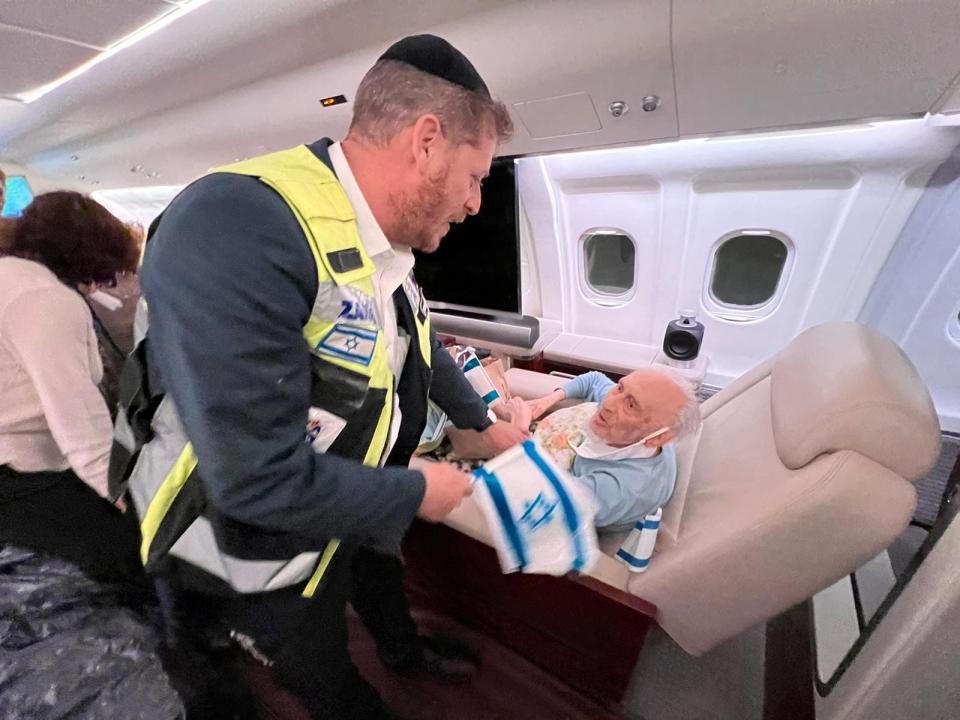 A Holocaust survivor on a converted private jet which will take him to Israel.