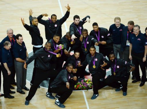 US players pose with their gold medals after winning the London 2012 Olympic Games men's basketball competition at the North Greenwich Arena in London