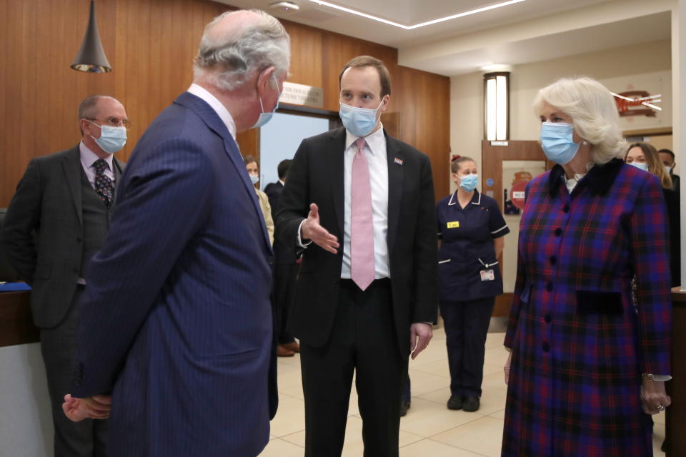 BIRMINGHAM, ENGLAND - FEBRUARY 17: Prince Charles, Prince of Wales and Camilla, Duchess of Cornwall talk with Health Secretary Matt Hancock during a visit to The Queen Elizabeth Hospital on February 17, 2021 in Birmingham, England. (Photo by Molly Darlington - WPA Pool/Getty Images)