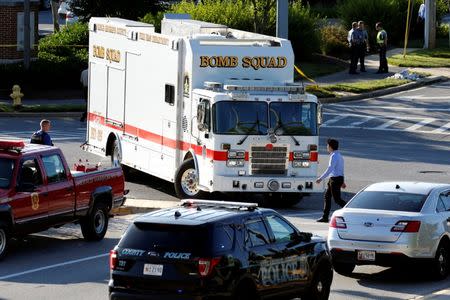 Emergency response vehicles drive near a shooting scene after a gunman opened fire at the Capital Gazette newspaper in Annapolis, Maryland, U.S., June 28, 2018. REUTERS/Joshua Roberts