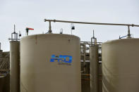 Tanks containing produced water are seen at a wastewater injection facility operated by H20 Midstream in Big Spring, Texas U.S. February 13, 2019. Picture taken February 13, 2019. REUTERS/Nick Oxford