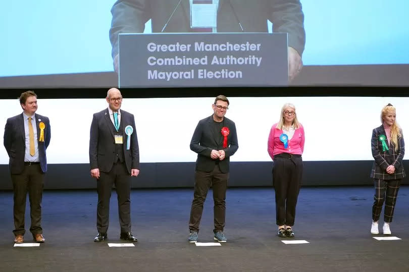 Andy Burnham (centre) is re-elected as Greater Manchester mayor -Credit:Peter Byrne/PA Wire
