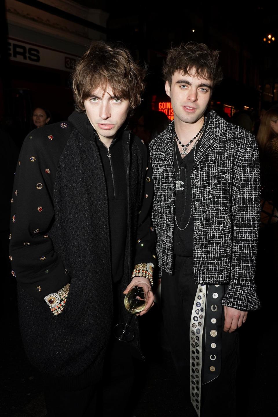 Gene Gallagher and Lennon Gallagher wear Chanel at the Metiers D'Art Show (Getty Images)