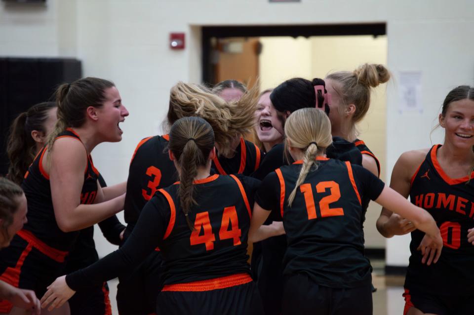 Homer celebrates Emma Jones' 3-pointer buzzer beater.