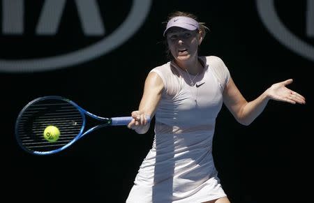 Tennis - Australian Open - Rod Laver Arena, Melbourne, Australia, January 18, 2018. Maria Sharapova of Russia hits a shot against Anastasija Sevastova of Latvia. REUTERS/Thomas Peter