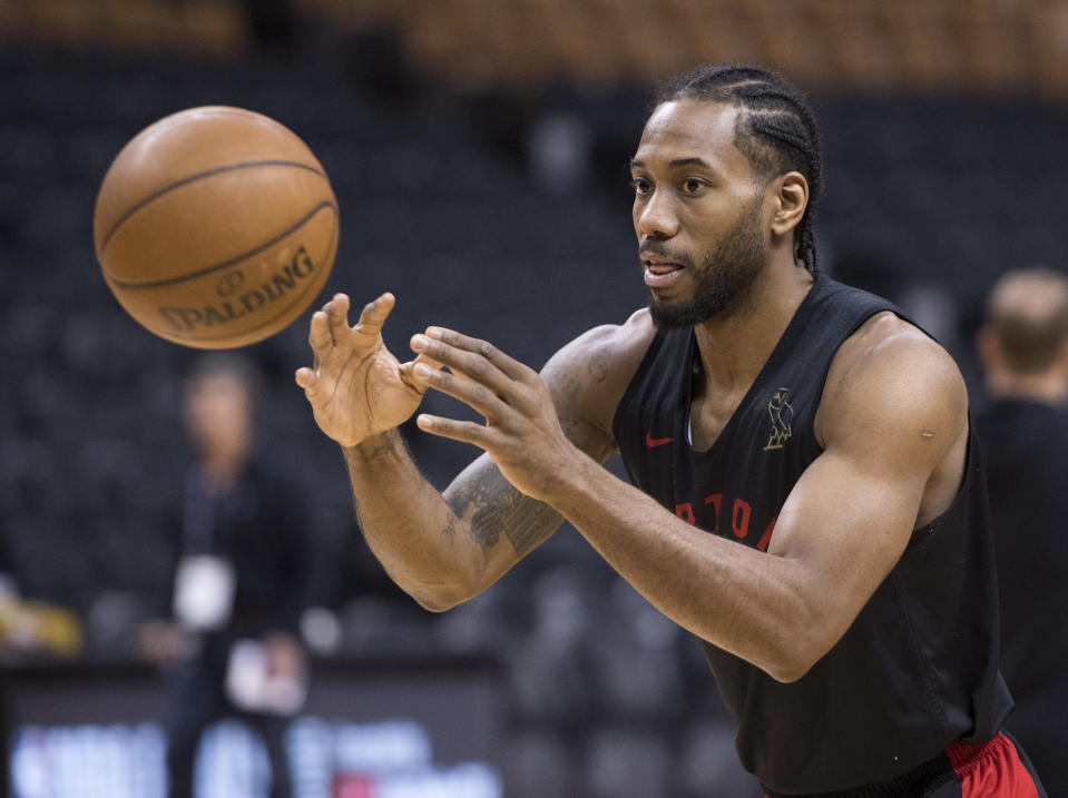 Toronto Raptors' Kawhi Leonard passes during practice for the NBA Finals in Toronto on Wednesday, May 29, 2019. Game 1 of the NBA Finals between the Raptors and Golden State Warriors is Thursday in Toronto. (Frank Gunn/The Canadian Press via AP)