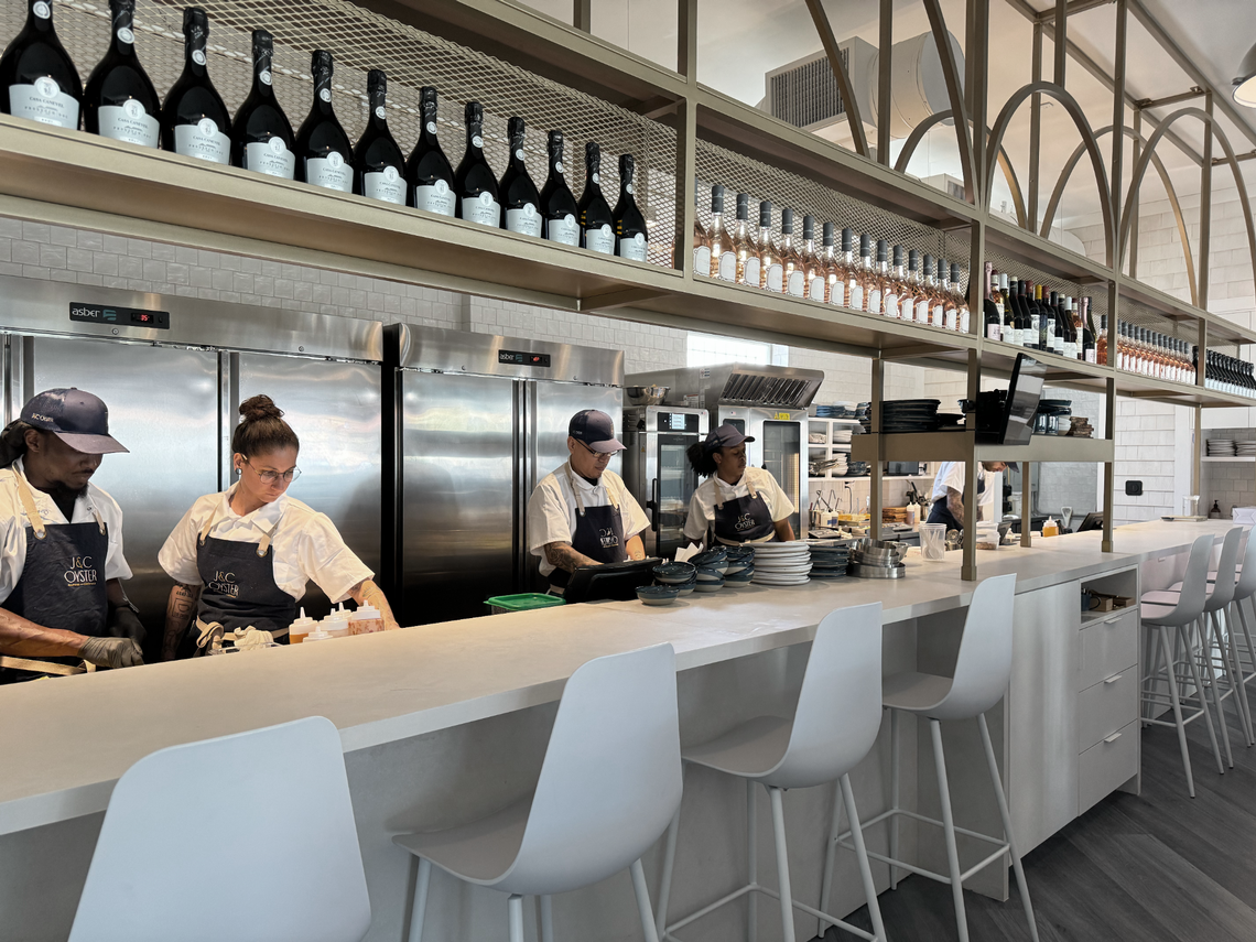 The staff works in the open kitchen at J&C Oyster restaurant in Hollywood.