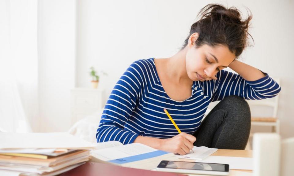 Asian student studying at table