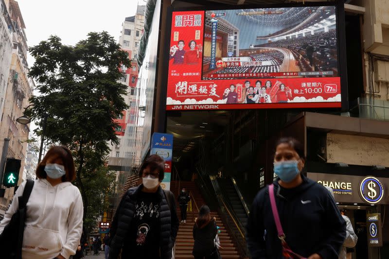 A TV screen showing news over the opening session of the National People's Congress (NPC), is seen in Hong Kong