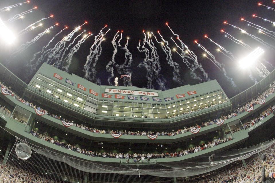 FILE - This photo by Associated Press photographer Elise Amendola shows fireworks over the Fenway Park press box before the opening game of the baseball season between the Boston Red Sox and New York Yankees Sunday, April 4, 2010, in Boston. Amendola, who recently retired from the AP, died Thursday, May 11, 2023, at her home in North Andover, Mass., after a 13-year battle with ovarian cancer. She was 70. (AP Photo/Elise Amendola, File)