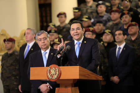 Guatemalan President Jimmy Morales address to the media next to Vice President Jafeth Cabrera at the National Palace in Guatemala City, Guatemala, August 31, 2018. Guatemalan Presidency/Handout via REUTERS